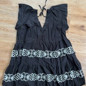 Black embroidered dress with white flower details